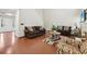 Cozy living room with warm wood floors and comfortable seating at 250 Kensington Trce, Stockbridge, GA 30281