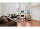 Spacious living room with a fireplace, tall ceilings, and large windows at 250 Kensington Trce, Stockbridge, GA 30281