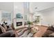 Living room showcasing fireplace and open flow to kitchen area at 250 Kensington Trce, Stockbridge, GA 30281