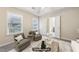 Spacious staged main bedroom sitting area with neutral decor, ceiling fan, and ensuite access at 250 Kensington Trce, Stockbridge, GA 30281