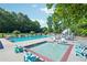 Community pool and splash pool with ample seating and a beautiful tree line at 250 Kensington Trce, Stockbridge, GA 30281