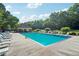 Community pool with a covered area for shade, plenty of seating and a surrounding tree line at 250 Kensington Trce, Stockbridge, GA 30281