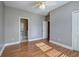 Bedroom featuring hardwood floors, neutral paint and an attached bathroom at 2500 Rosehill Cir, Lithia Springs, GA 30122