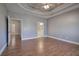 Large bedroom features wood floors, tray ceiling, and multiple doorways at 2500 Rosehill Cir, Lithia Springs, GA 30122