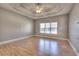 Spacious bedroom with wood floors, ceiling fan, and a large window at 2500 Rosehill Cir, Lithia Springs, GA 30122