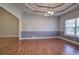 Dining room with wood floors and chair rail, open to other living areas at 2500 Rosehill Cir, Lithia Springs, GA 30122