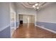 Formal dining room with trey ceiling, hardwood floors, and decorative lighting at 2500 Rosehill Cir, Lithia Springs, GA 30122