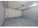 Spacious garage with concrete floor and an automatic garage door at 2500 Rosehill Cir, Lithia Springs, GA 30122