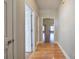 Hallway with hardwood floors leading into a bright and open living space at 2500 Rosehill Cir, Lithia Springs, GA 30122
