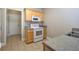 Galley kitchen featuring tile floors and lots of cabinet space at 2500 Rosehill Cir, Lithia Springs, GA 30122