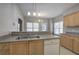 Bright kitchen features a double sink, stainless steel appliances, and granite countertops at 2500 Rosehill Cir, Lithia Springs, GA 30122