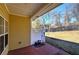 Covered brick patio with view of the lawn and trees at 2500 Rosehill Cir, Lithia Springs, GA 30122