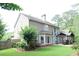 Spacious backyard with lush green lawn and patio furniture at 2720 Stillwater Lake Ln, Marietta, GA 30066
