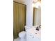 Well-maintained bathroom featuring a toilet, vanity with sink, a large mirror, and a shower with curtain at 2720 Stillwater Lake Ln, Marietta, GA 30066
