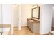 Clean bathroom with stone floors, a soaking tub, a large vanity with granite countertop, and ample storage space at 2720 Stillwater Lake Ln, Marietta, GA 30066