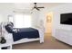 Bright bedroom with white walls, ceiling fan, and stylish furniture set at 2720 Stillwater Lake Ln, Marietta, GA 30066