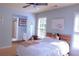Calming blue bedroom featuring a bed with plush toys, and an adjacent bathroom at 2720 Stillwater Lake Ln, Marietta, GA 30066