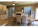 Dining room with a fireplace, modern table, and neutral chairs, perfect for gatherings and dinner parties at 2720 Stillwater Lake Ln, Marietta, GA 30066