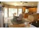 Bright kitchen with granite island, a breakfast bar, a fireplace, and an open layout perfect for entertaining guests at 2720 Stillwater Lake Ln, Marietta, GA 30066