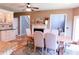 Open dining room features elegant chairs, a fireplace, and access to kitchen creating a welcoming atmosphere at 2720 Stillwater Lake Ln, Marietta, GA 30066