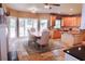 Open kitchen/dining room with stainless appliances, stone floors, granite countertops, and ample room for entertainment at 2720 Stillwater Lake Ln, Marietta, GA 30066