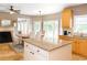 Bright eat-in kitchen with granite countertops, an island, stainless appliances, and a cozy dining area with fireplace at 2720 Stillwater Lake Ln, Marietta, GA 30066