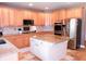 Spacious kitchen featuring granite countertops, an island, stainless appliances, and ample cabinetry for storage at 2720 Stillwater Lake Ln, Marietta, GA 30066