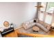 Bright living room featuring a high ceiling, large windows with curtains, and comfortable seating area at 2720 Stillwater Lake Ln, Marietta, GA 30066