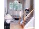 Bright living room with large windows, a vaulted ceiling, neutral decor, and a staircase with wrought iron spindles at 2720 Stillwater Lake Ln, Marietta, GA 30066