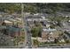 Aerial view of buildings, streets, and surrounding trees in a well-maintained town center at 7650 Abbey Glen Dr, Cumming, GA 30028