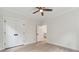 Bedroom with light wood floors, ceiling fan, closet with double doors and neutral paint at 7650 Abbey Glen Dr, Cumming, GA 30028