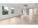 Spacious bedroom with plenty of natural light, light wood flooring, and a ceiling fan at 7650 Abbey Glen Dr, Cumming, GA 30028