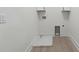 Clean, bright laundry room with hookups and storage space at 7650 Abbey Glen Dr, Cumming, GA 30028