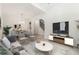 Comfortable living room with an open floor plan, stylish furnishings, and abundant natural light at 7650 Abbey Glen Dr, Cumming, GA 30028