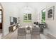 Bright living room with vaulted ceilings and large windows, offering a comfortable space with elegant decor at 7650 Abbey Glen Dr, Cumming, GA 30028