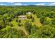 Areal shot of the property showing the house, outbuilding and the surrounding landscape at 195 Connesena Rd, Kingston, GA 30145