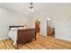 Spacious bedroom showcasing hardwood floors and connecting closet and bathroom at 195 Connesena Rd, Kingston, GA 30145