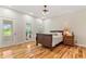 Bright bedroom with hardwood floors and access to an outdoor patio through glass doors at 195 Connesena Rd, Kingston, GA 30145