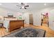 Spacious bedroom featuring hardwood floors, a ceiling fan, and an attached closet at 195 Connesena Rd, Kingston, GA 30145