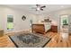 Cozy bedroom with hardwood floors, natural light, and rustic wooden bed frame at 195 Connesena Rd, Kingston, GA 30145