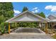 Attached carport with a concrete pad and wooden support beams on a well manicured lawn at 195 Connesena Rd, Kingston, GA 30145