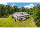 Exterior view of home showcasing large yard and metal roof at 195 Connesena Rd, Kingston, GA 30145