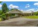 Exterior view of the home with an attached carport at 195 Connesena Rd, Kingston, GA 30145