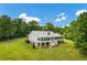 Expansive backyard with lush green grass, white exterior, and metal roof, creating a serene retreat at 195 Connesena Rd, Kingston, GA 30145