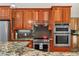 Kitchen features stainless steel appliances including oven, stove and refrigerator, granite counters, and wood cabinets at 195 Connesena Rd, Kingston, GA 30145