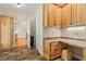 Well-organized kitchen with ample cabinet space, granite countertops, and view of the breakfast area at 195 Connesena Rd, Kingston, GA 30145