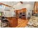 Spacious kitchen with granite counters, custom cabinets, and stainless steel appliances at 195 Connesena Rd, Kingston, GA 30145