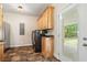 Spacious laundry room with modern washer and dryer, wooden cabinets, and lots of storage at 195 Connesena Rd, Kingston, GA 30145