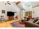 Bright living room featuring vaulted ceiling, hardwood floors, and cozy seating arrangement at 195 Connesena Rd, Kingston, GA 30145