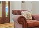 Close up of cozy chair near door, detailed upholstery and bright natural light at 195 Connesena Rd, Kingston, GA 30145